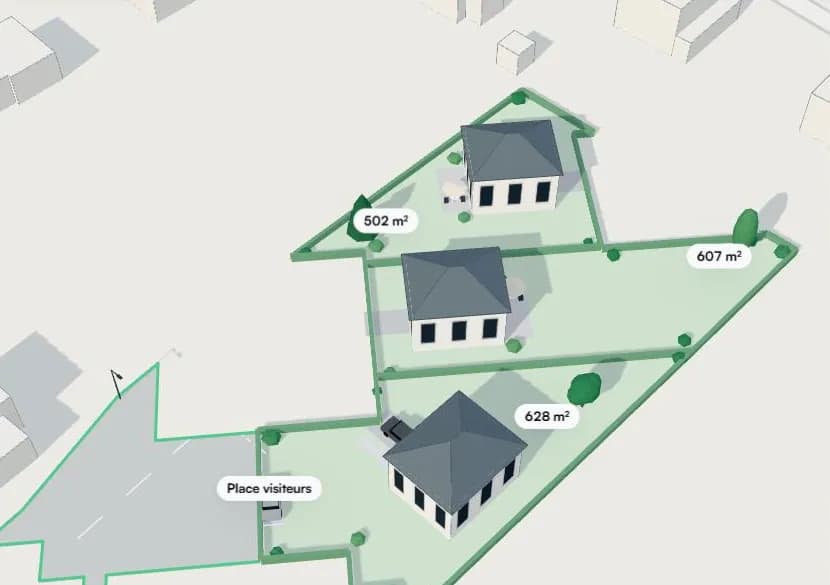Vue 3D : trois terrains à bâtir autour d’une voie commune.